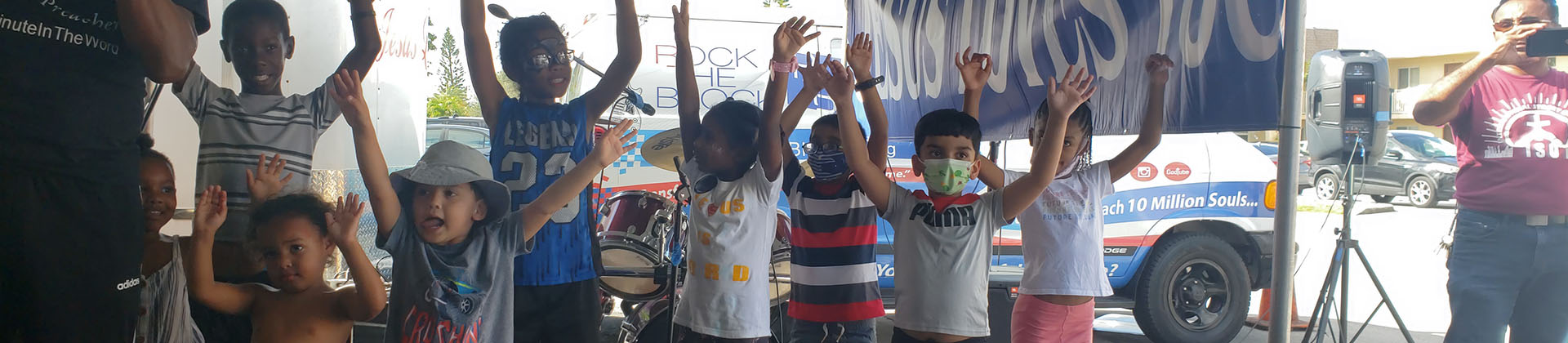 children raising their hands